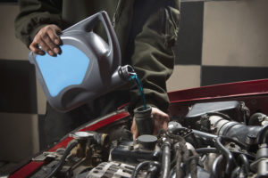Speedy Apollo mechanic adding cooling fluid