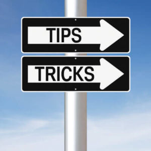 sign with tips and tricks written on them
