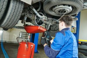 man repairing under the car