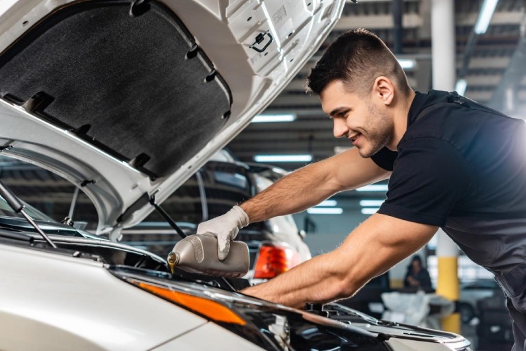 Professional conducting an oil change