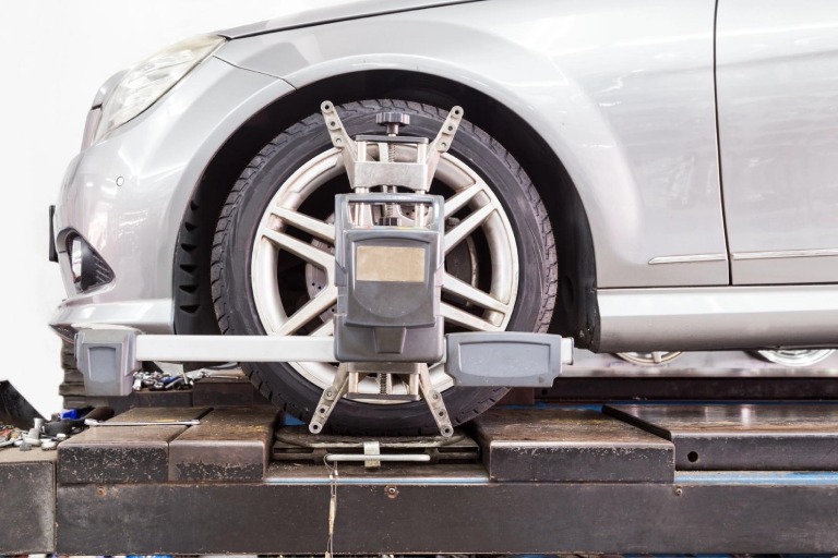A car is getting its wheels aligned